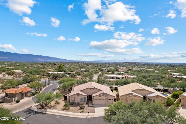 birds eye view of property with a mountain view