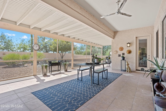 sunroom / solarium with beamed ceiling