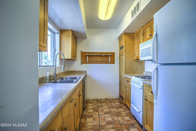 kitchen with sink and white appliances