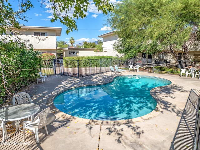 view of swimming pool featuring a patio