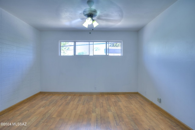 empty room with wood-type flooring and ceiling fan