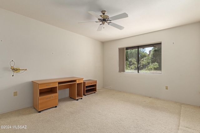 office with light carpet and ceiling fan