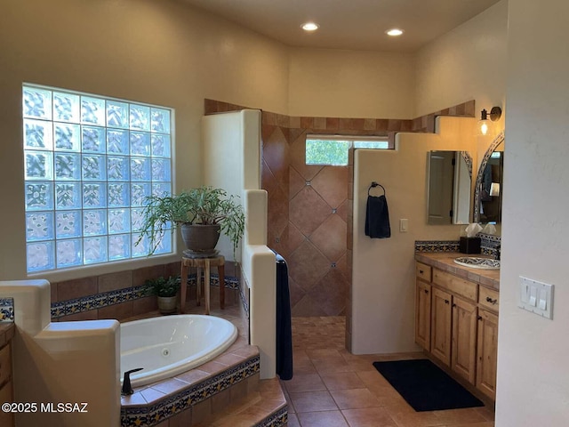 5550 W Open R Pl, Tucson, AZ 85713 - bathroom with vanity, a walk in shower, a tub with jets, tile patterned floors, and recessed lighting