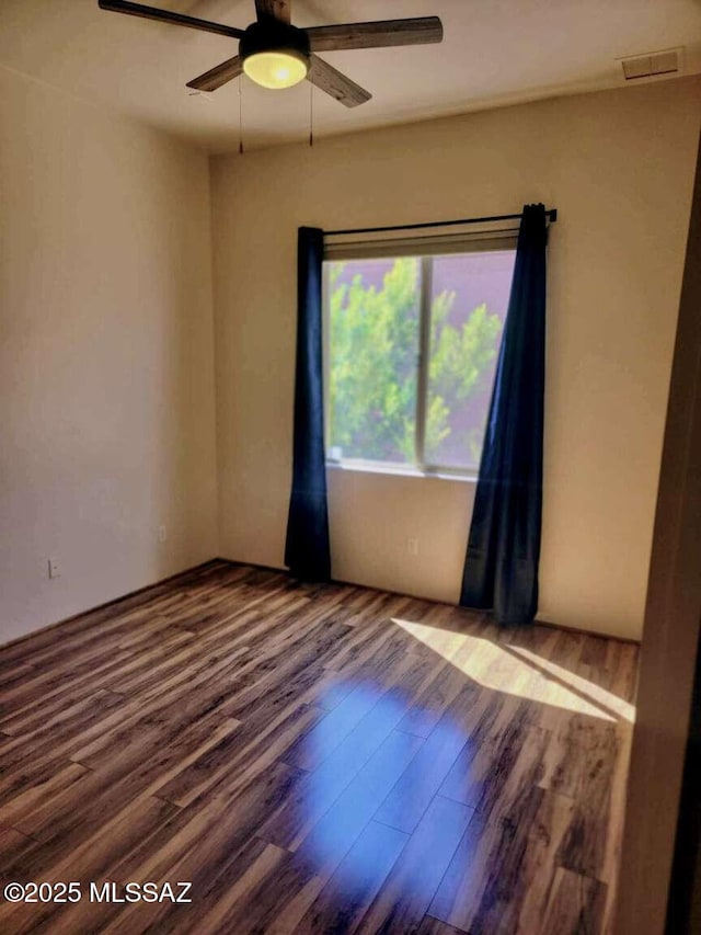 5550 W Open R Pl, Tucson, AZ 85713 - unfurnished room with wood finished floors and a ceiling fan