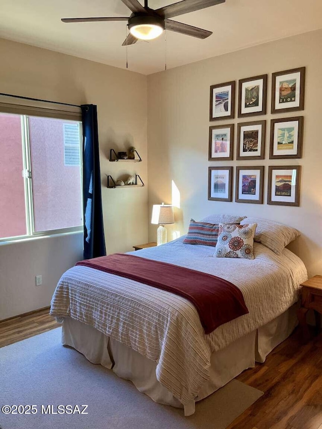 5550 W Open R Pl, Tucson, AZ 85713 - bedroom with wood finished floors and a ceiling fan