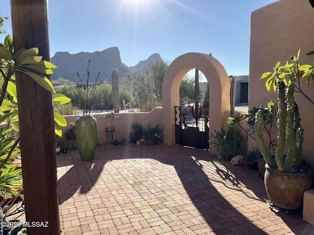 5550 W Open R Pl, Tucson, AZ 85713 - view of patio featuring a mountain view, a gate, and fence