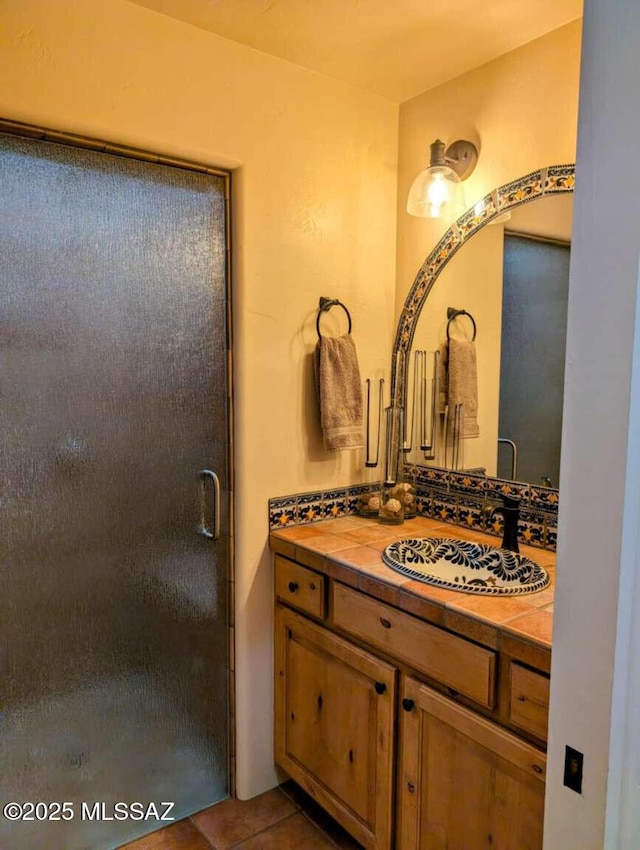 5550 W Open R Pl, Tucson, AZ 85713 - bathroom with vanity, a stall shower, and tile patterned flooring