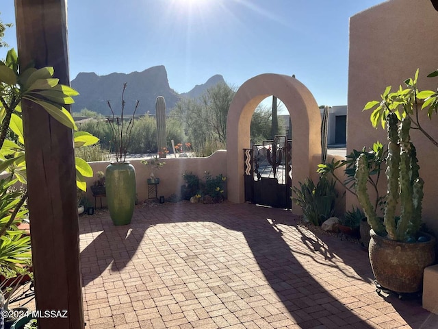 view of patio / terrace with a mountain view