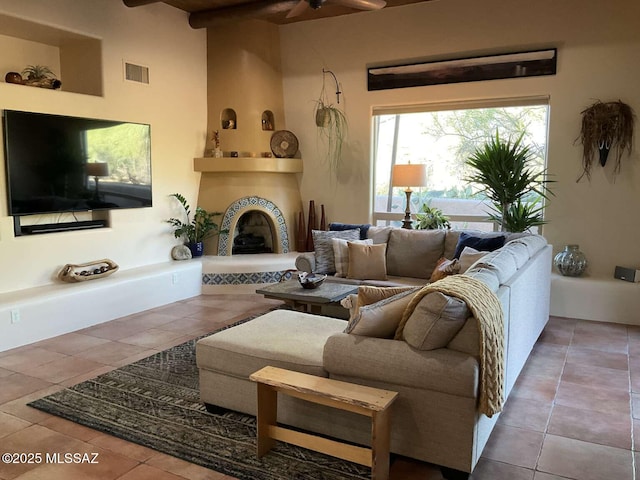 5550 W Open R Pl, Tucson, AZ 85713 - tiled living area with a ceiling fan and a tiled fireplace