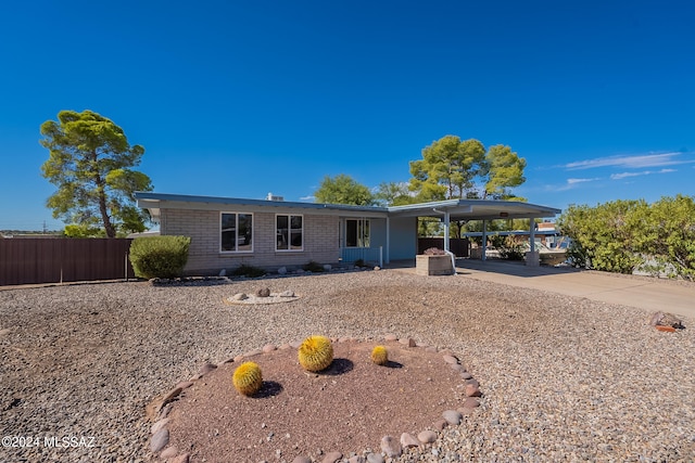 single story home with a carport