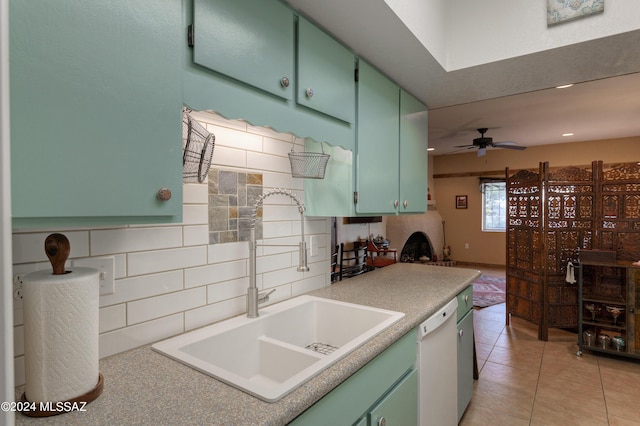 2798 S Camino Selva, Green Valley, AZ 85622 - kitchen featuring a sink, white dishwasher, light tile patterned flooring, green cabinets, and ceiling fan
