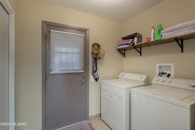 2798 S Camino Selva, Green Valley, AZ 85622 - laundry room featuring separate washer and dryer, a textured ceiling, laundry area, and light tile patterned flooring