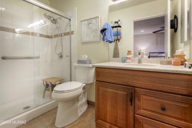 2798 S Camino Selva, Green Valley, AZ 85622 - ensuite bathroom featuring a shower stall, tile patterned floors, toilet, vanity, and connected bathroom