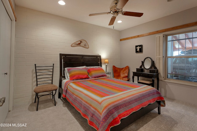 bedroom with brick wall, ceiling fan, carpet flooring, and recessed lighting