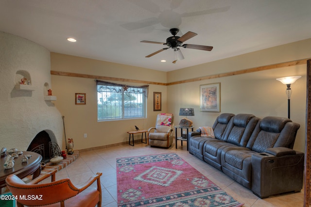 living area featuring light tile patterned flooring, recessed lighting, a fireplace, a ceiling fan, and baseboards