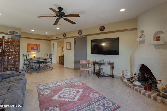 2798 S Camino Selva, Green Valley, AZ 85622 - tiled living room with recessed lighting, a brick fireplace, a ceiling fan, and baseboards