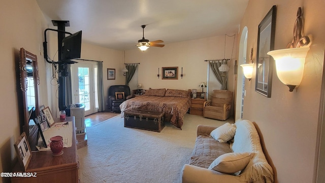 carpeted bedroom with access to outside and ceiling fan