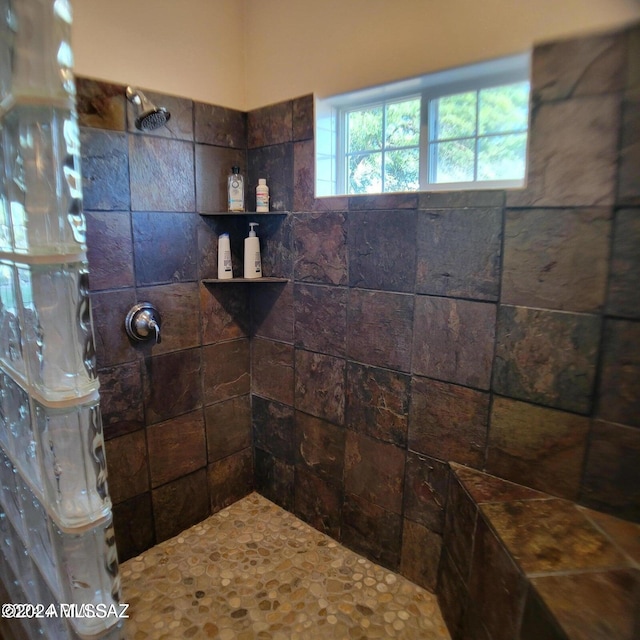 bathroom featuring tiled shower