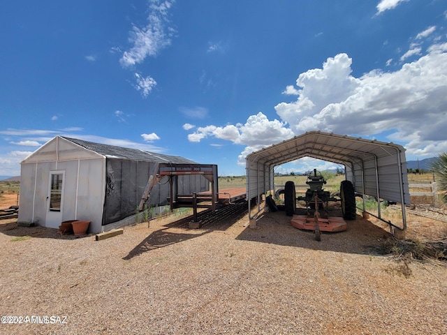 view of outbuilding featuring a carport