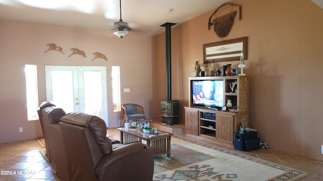 living room with french doors, light tile patterned floors, and ceiling fan