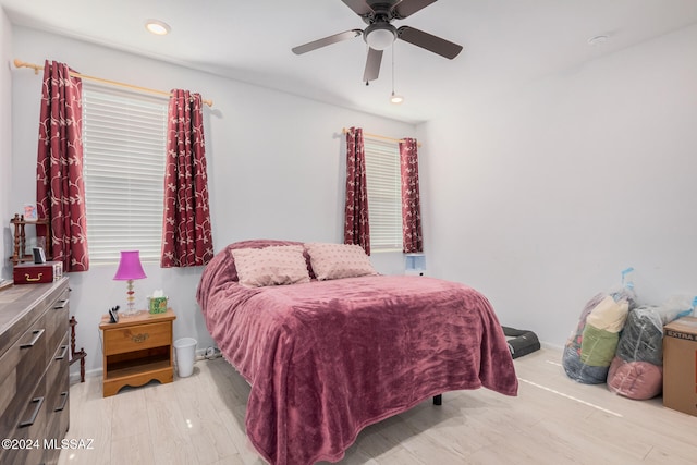 bedroom featuring light wood-type flooring and ceiling fan