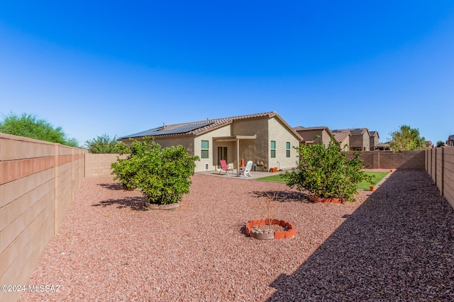 back of property featuring a patio area