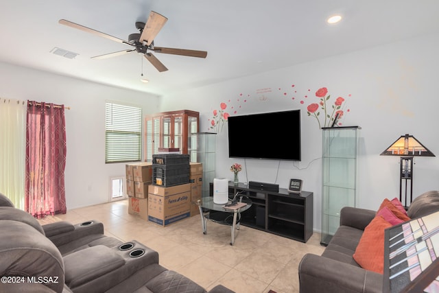 living room with light tile patterned floors and ceiling fan