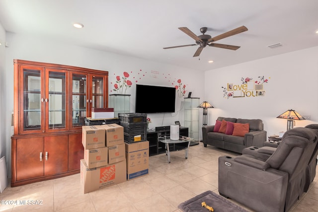 living room featuring light tile patterned floors and ceiling fan