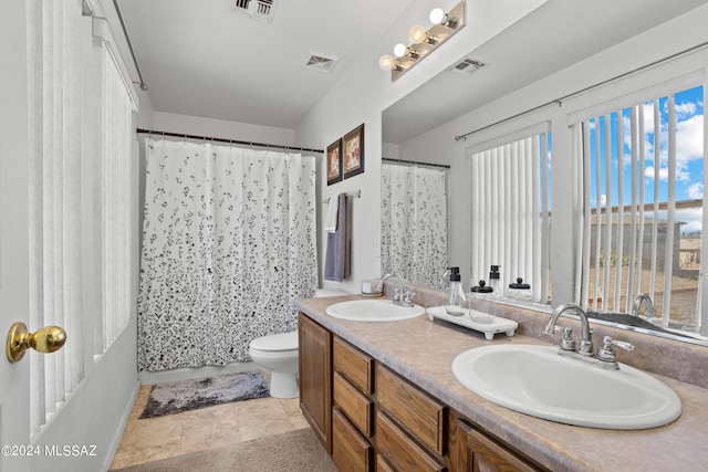 bathroom with toilet, a shower with curtain, vanity, and tile patterned flooring