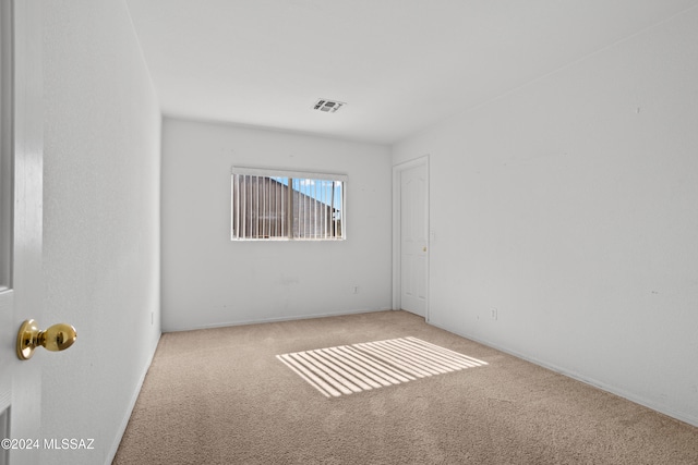 empty room with carpet flooring