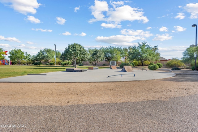 view of property's community with a patio area and a yard