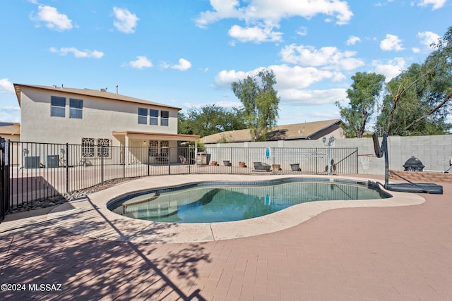 view of swimming pool featuring a patio