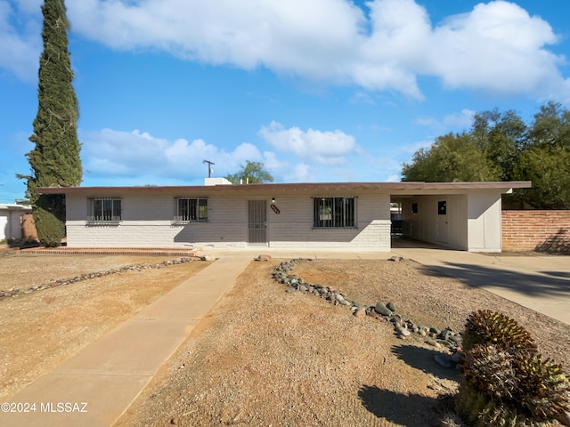 ranch-style house with a carport