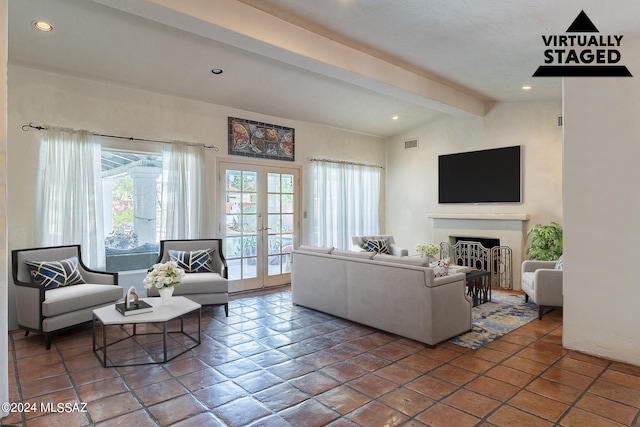 living room with french doors and lofted ceiling with beams