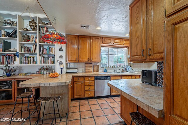 kitchen featuring tasteful backsplash and sink