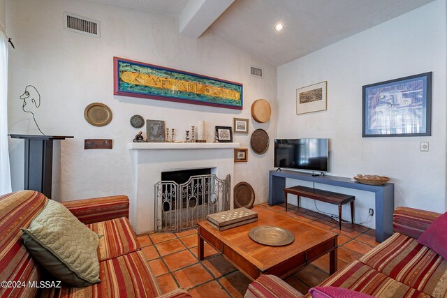 tiled living room featuring french doors, vaulted ceiling, and a healthy amount of sunlight