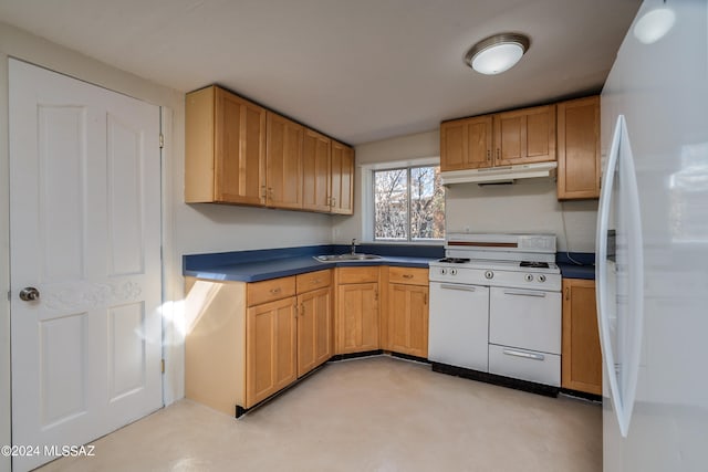 kitchen featuring sink and white appliances