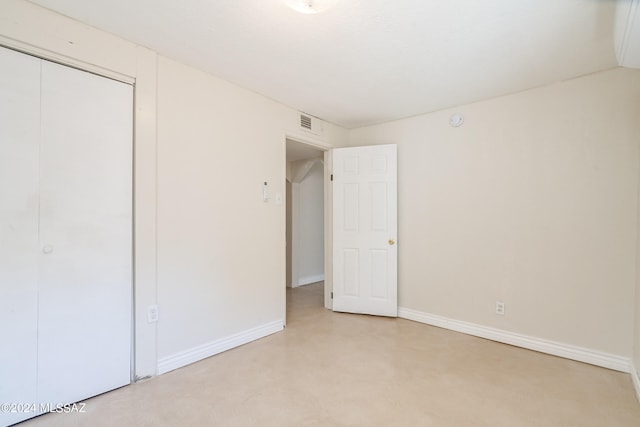 unfurnished bedroom with a closet