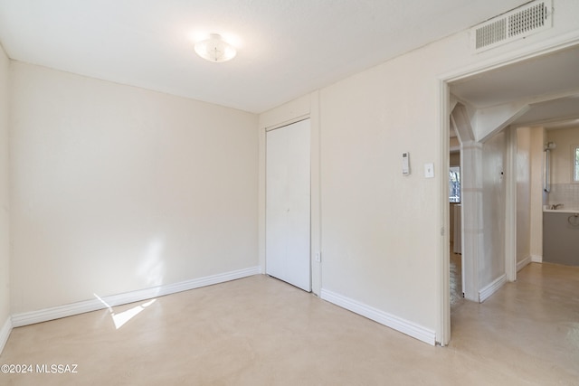 unfurnished bedroom featuring a closet