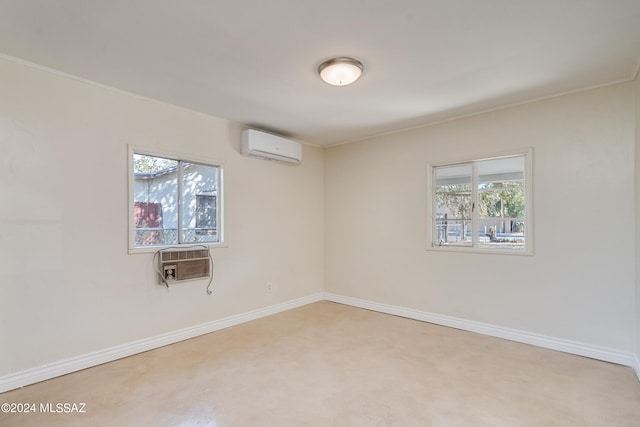 unfurnished room featuring carpet floors, ornamental molding, plenty of natural light, and a wall mounted air conditioner