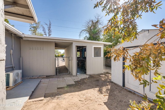 view of exterior entry with ac unit