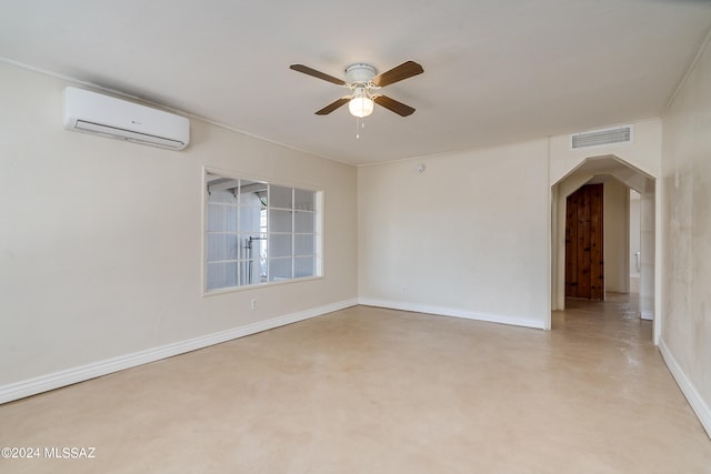 unfurnished room with ceiling fan and a wall mounted air conditioner