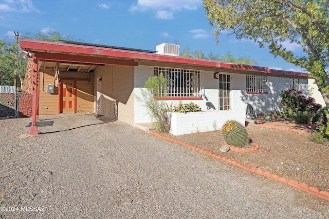 view of home's exterior featuring a carport