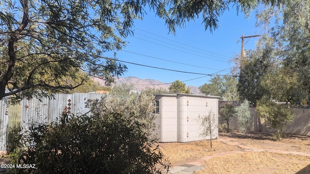 view of outbuilding with a mountain view