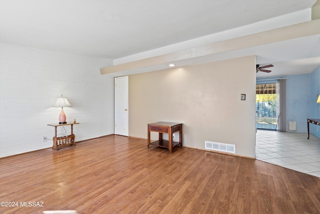 unfurnished room featuring wood-type flooring and ceiling fan