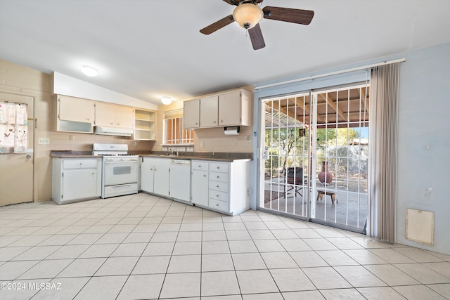 kitchen featuring light tile patterned floors, vaulted ceiling, white appliances, and ceiling fan