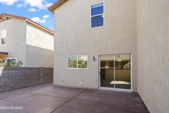 back of house with a patio area