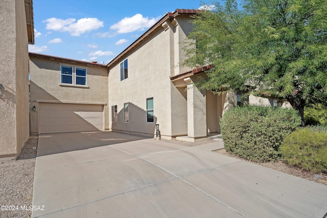 view of side of property featuring a garage