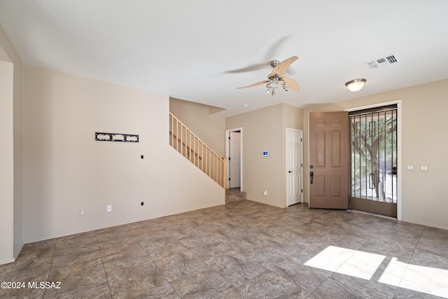 entrance foyer with ceiling fan