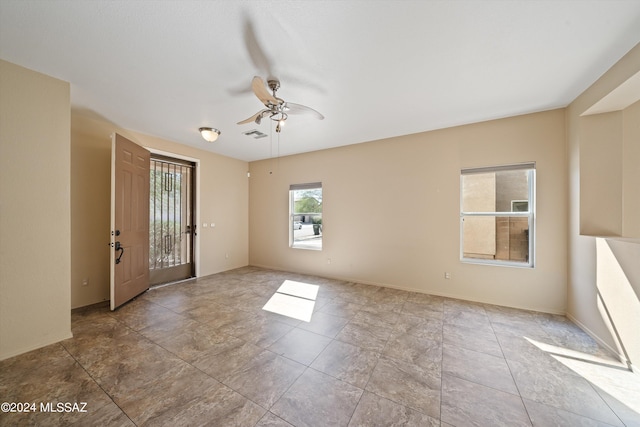 foyer entrance with ceiling fan